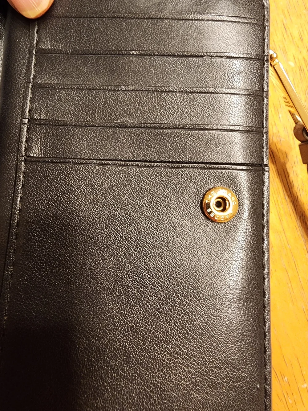 Marc Jacobs The Softshot Mini Compact Wallet is crafted from grained leather
